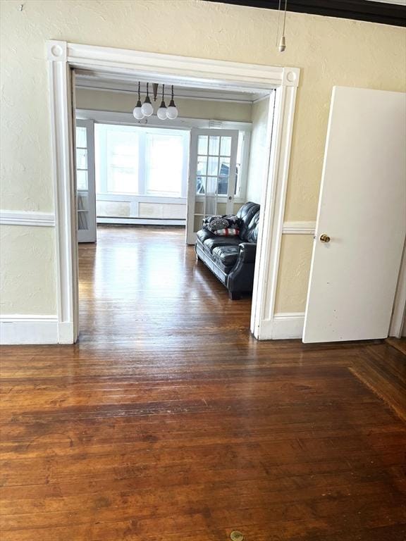 23 Highland Rd, Somerville, MA 02144 - hallway featuring a textured wall, wood-type flooring, and a chandelier