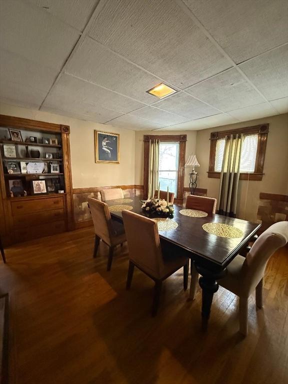 dining space with hardwood / wood-style floors