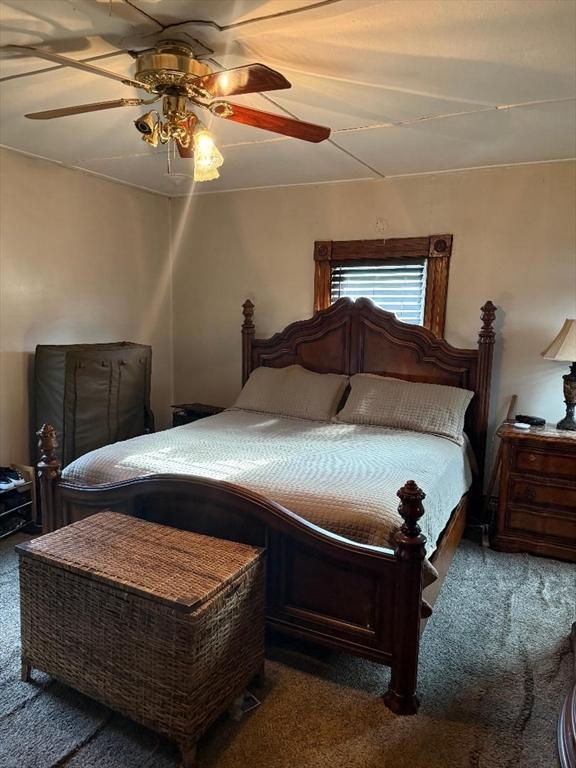 bedroom featuring ceiling fan and carpet floors