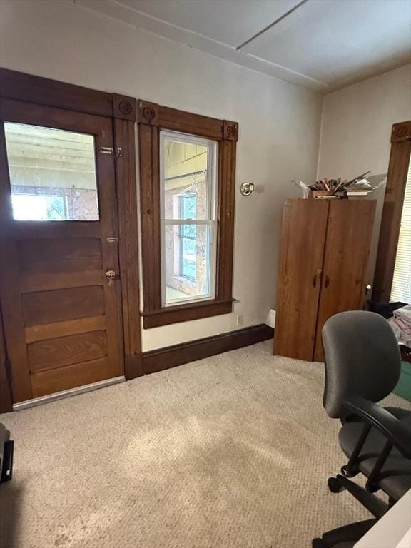 unfurnished office featuring carpet flooring