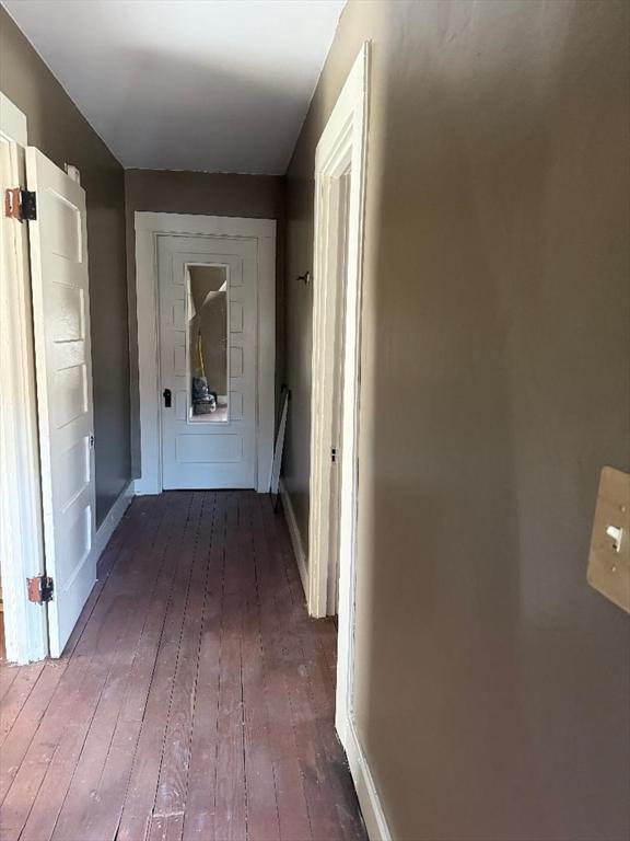 hallway featuring dark hardwood / wood-style floors