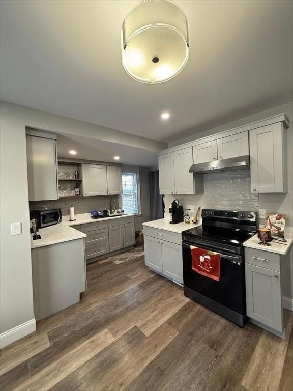 kitchen with gray cabinets, black range with electric stovetop, and dark hardwood / wood-style floors