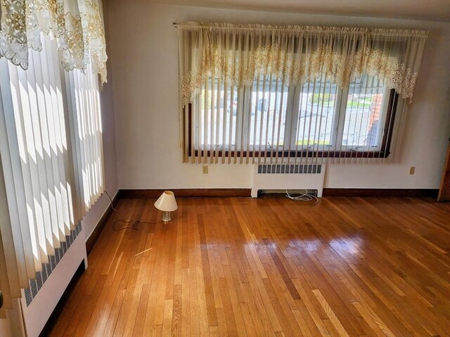 55 Kilburn St, Revere, MA 02151 - interior space featuring plenty of natural light, radiator heating unit, and baseboards