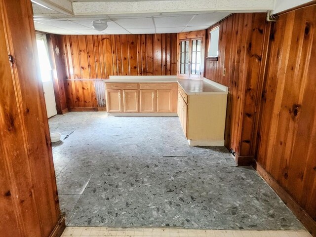 55 Kilburn St, Revere, MA 02151 - interior space featuring wooden walls, a drop ceiling, and baseboards