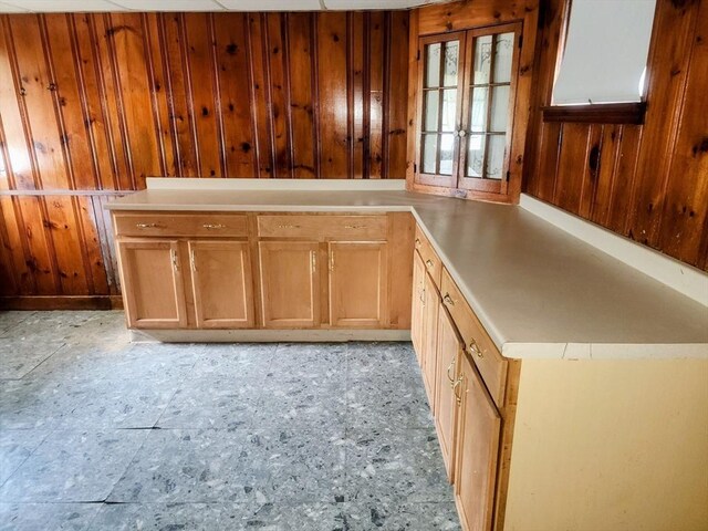 55 Kilburn St, Revere, MA 02151 - kitchen with wooden walls, brown cabinets, and light countertops