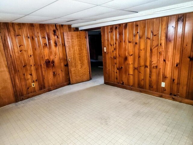 55 Kilburn St, Revere, MA 02151 - finished below grade area featuring wood walls, a drop ceiling, and baseboards