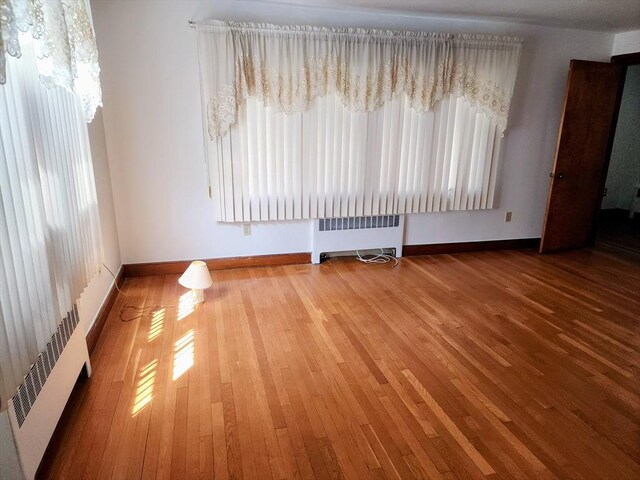 55 Kilburn St, Revere, MA 02151 - interior space with radiator, a wealth of natural light, and baseboards