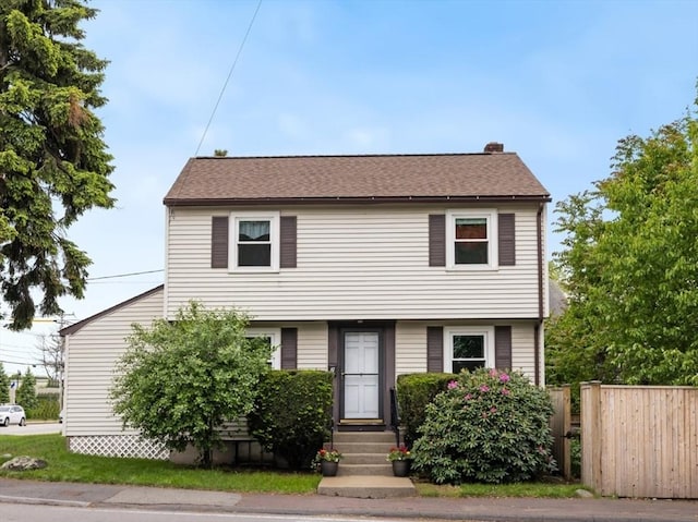 2 Olympia Ave, Woburn, MA 01801 - colonial house featuring entry steps, roof with shingles, and a chimney
