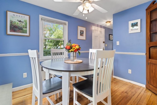 2 Olympia Ave, Woburn, MA 01801 - dining room with baseboards, ceiling fan, and light wood-type flooring