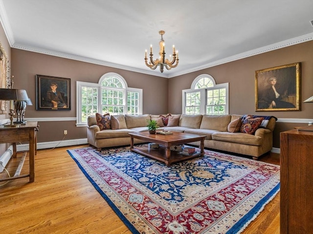 21A Farm St, Dover, MA 02030 - living room featuring light wood finished floors, crown molding, a chandelier, baseboards, and baseboard heating