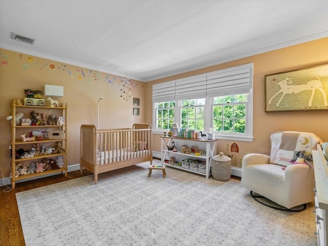 21A Farm St, Dover, MA 02030 - bedroom featuring crown molding, wood finished floors, and baseboards