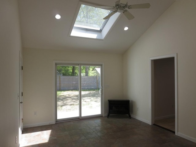 130 Fuller Rd, Barnstable, MA 02632 - unfurnished living room featuring a skylight, baseboards, high vaulted ceiling, ceiling fan, and recessed lighting