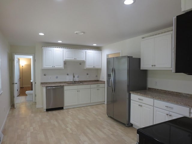 130 Fuller Rd, Barnstable, MA 02632 - kitchen with appliances with stainless steel finishes, a sink, white cabinets, and recessed lighting