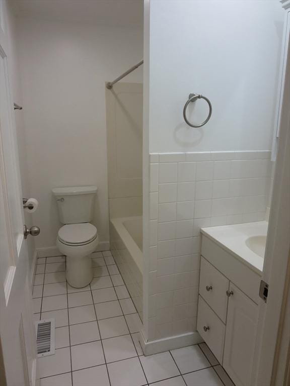 130 Fuller Rd, Barnstable, MA 02632 - bathroom featuring tile patterned floors, toilet, vanity, and washtub / shower combination