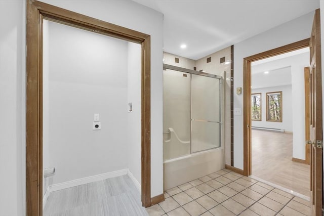 bathroom with bath / shower combo with glass door, baseboards, baseboard heating, and recessed lighting