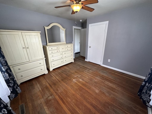 unfurnished bedroom featuring dark hardwood / wood-style flooring and ceiling fan