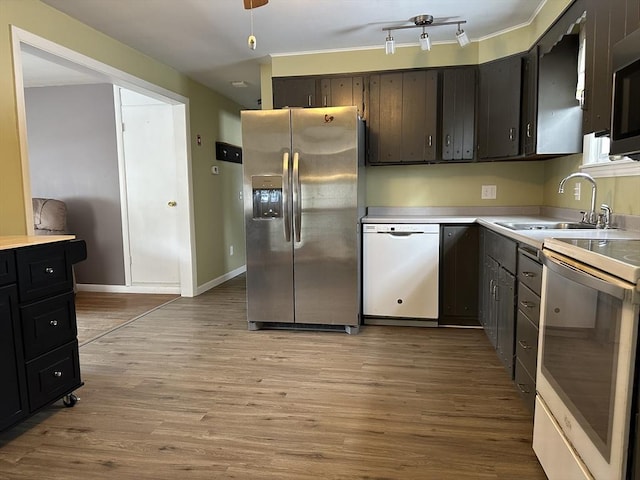 kitchen featuring sink, stainless steel appliances, and light wood-type flooring