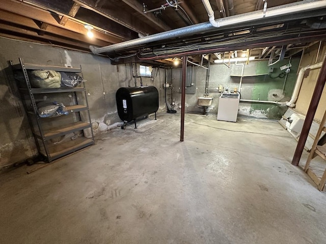 basement featuring washer and dryer and sink