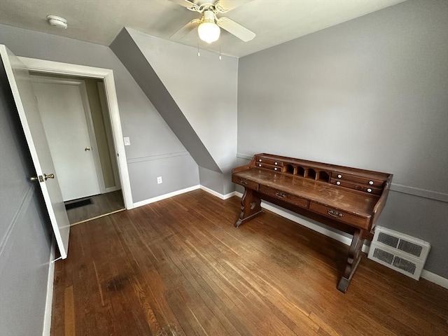 misc room with dark wood-type flooring and ceiling fan