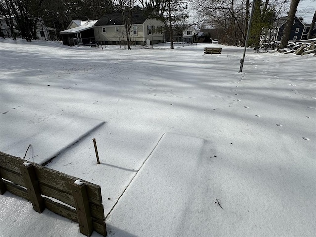 view of yard layered in snow