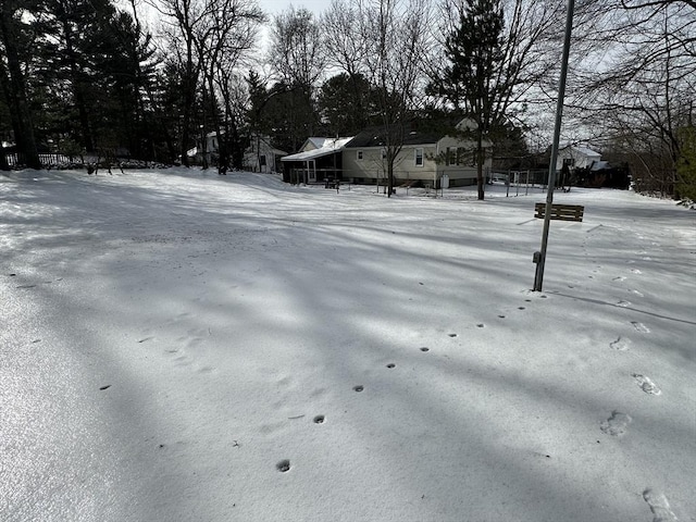 view of yard covered in snow