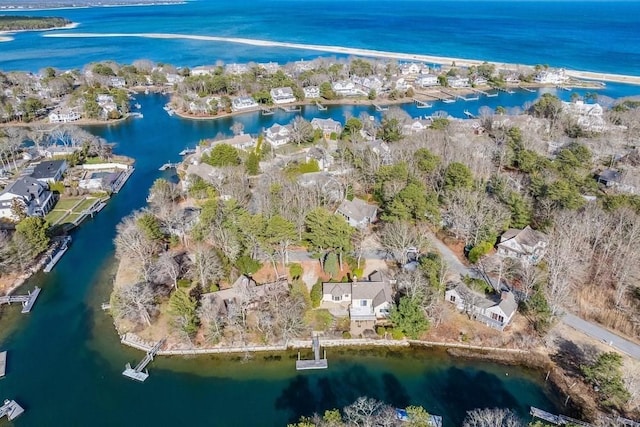 bird's eye view with a water view and a residential view