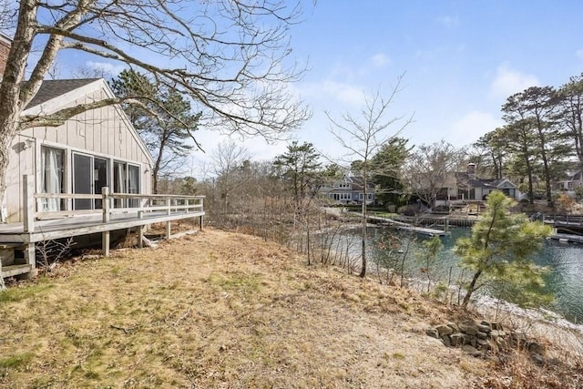 view of yard featuring a deck with water view