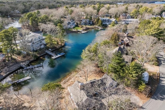 drone / aerial view with a residential view and a water view