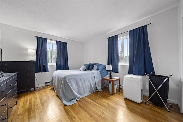 79 Poplar St Unit 10, Boston, MA 02131 - bedroom featuring light wood-type flooring and baseboards