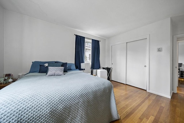 79 Poplar St Unit 10, Boston, MA 02131 - bedroom with wood finished floors and a closet