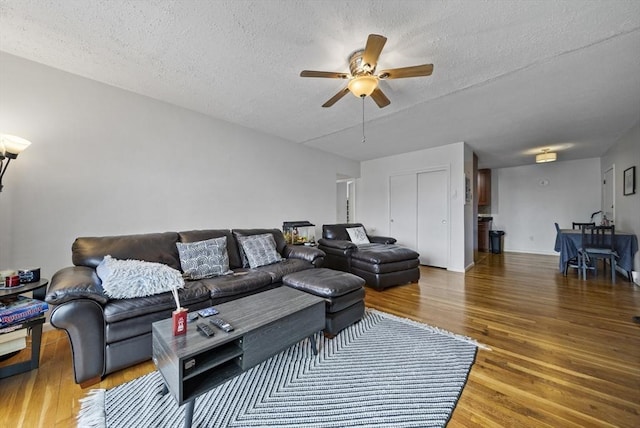 79 Poplar St Unit 10, Boston, MA 02131 - living room with a ceiling fan, wood finished floors, and a textured ceiling