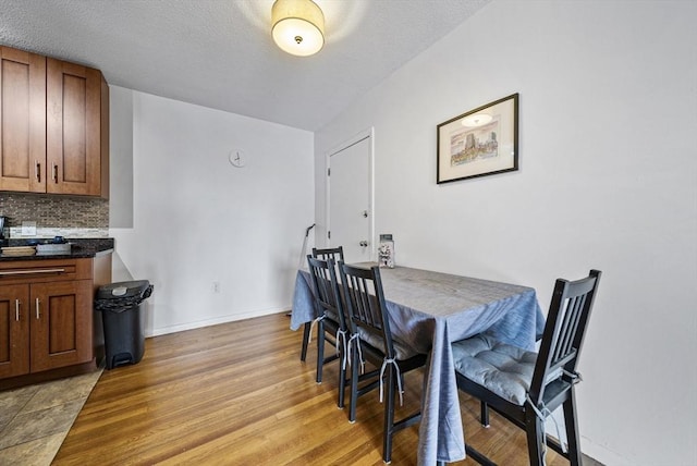 79 Poplar St Unit 10, Boston, MA 02131 - dining space featuring light wood-type flooring and baseboards