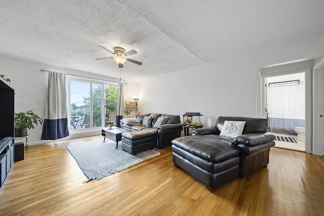 79 Poplar St Unit 10, Boston, MA 02131 - living room featuring a textured ceiling, ceiling fan, and hardwood / wood-style floors