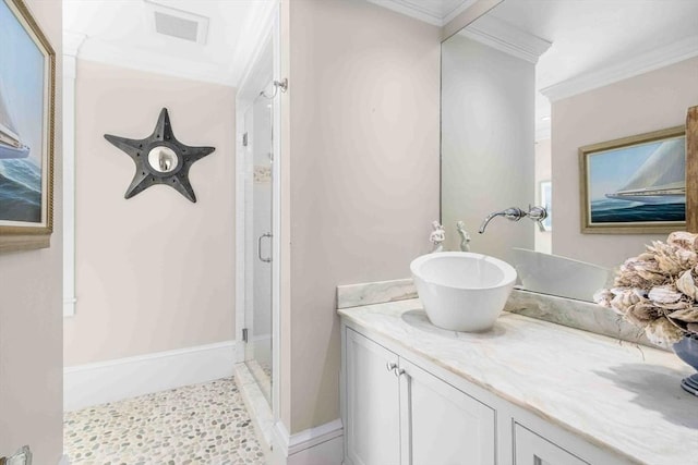 8 S St, Dennis, MA 02639 - bathroom with ornamental molding, a shower stall, vanity, and baseboards