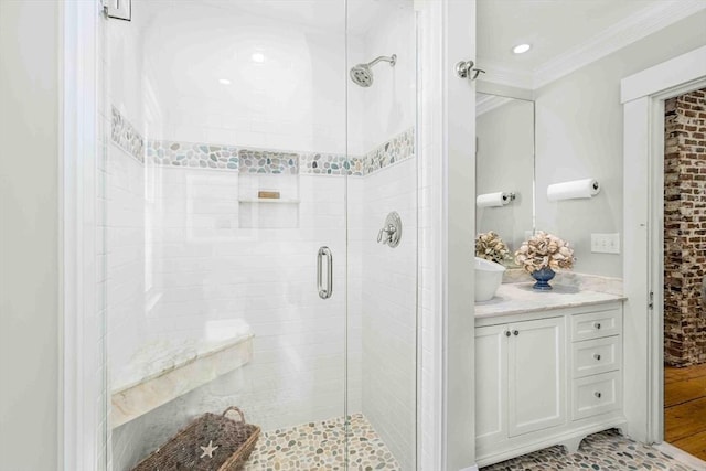 8 S St, Dennis, MA 02639 - full bathroom with a stall shower, ornamental molding, vanity, and recessed lighting