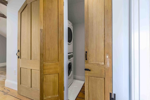 8 S St, Dennis, MA 02639 - laundry room with stacked washer and clothes dryer and baseboards