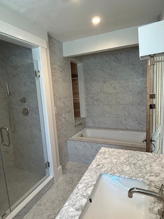 8 S St, Dennis, MA 02639 - bathroom featuring a garden tub, marble finish flooring, and a shower stall