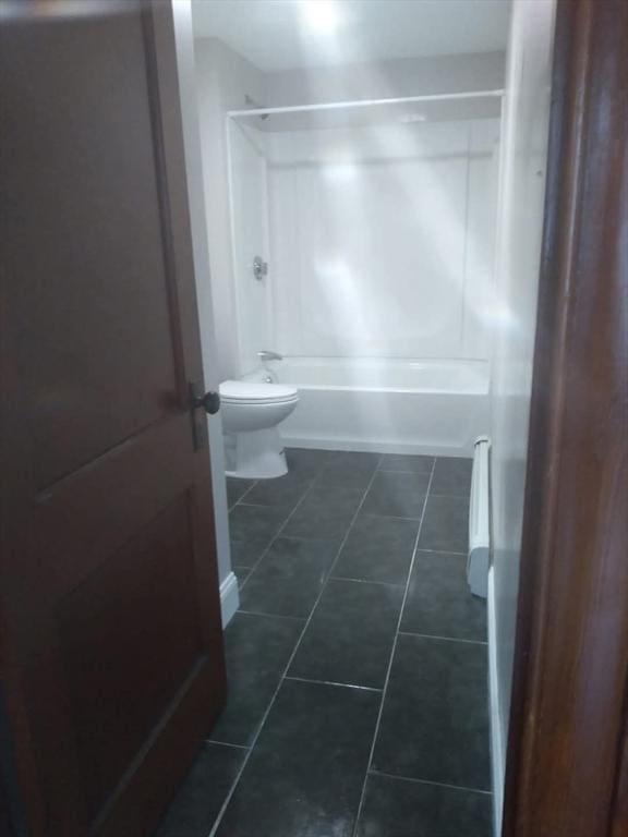 129 Marchand St, Fall River, MA 02723 - bathroom with tub / shower combination, tile patterned floors, and toilet
