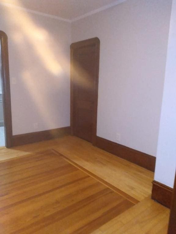 129 Marchand St, Fall River, MA 02723 - empty room with wood finished floors and ornamental molding