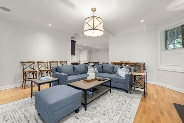 living area with light wood-type flooring, ornamental molding, baseboards, and recessed lighting