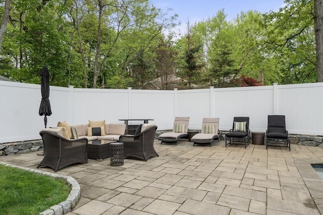 view of patio / terrace featuring outdoor lounge area and a fenced backyard