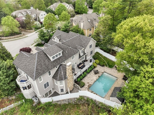 aerial perspective of suburban area with a pool