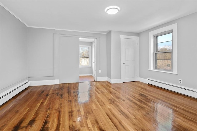 foyer with hardwood / wood-style flooring and baseboard heating