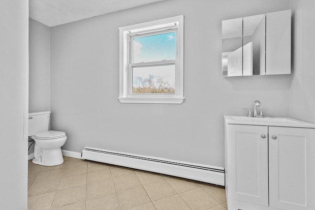 bathroom with tile patterned floors, vanity, a baseboard radiator, and toilet