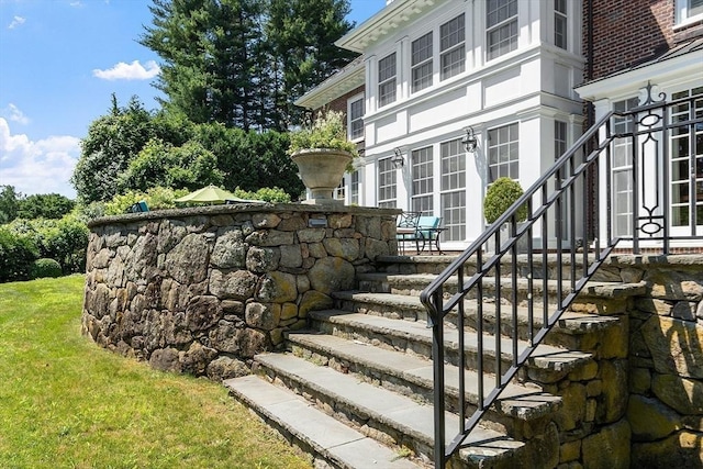 29 Willard Cmn, Concord, MA 01742 - doorway to property with a lawn