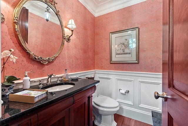 29 Willard Cmn, Concord, MA 01742 - bathroom with wood finished floors, wallpapered walls, wainscoting, vanity, and crown molding