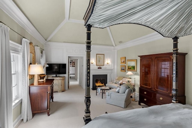 29 Willard Cmn, Concord, MA 01742 - bedroom with vaulted ceiling, a large fireplace, and light colored carpet
