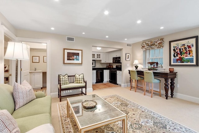 29 Willard Cmn, Concord, MA 01742 - living room featuring baseboards, recessed lighting, and light carpet