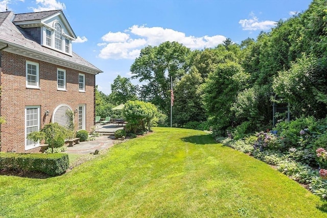 29 Willard Cmn, Concord, MA 01742 - view of grassy yard with a patio area