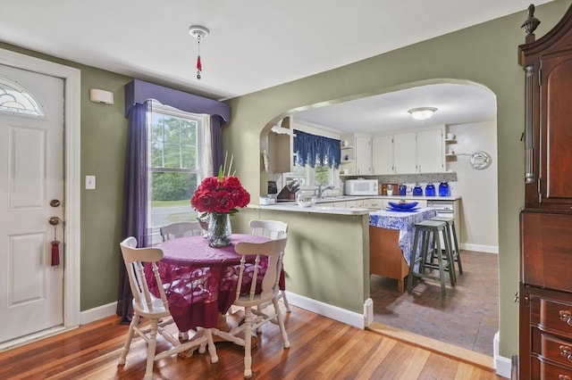 49 Winchendon Rd, Templeton, MA 01436 - dining space with arched walkways and wood finished floors